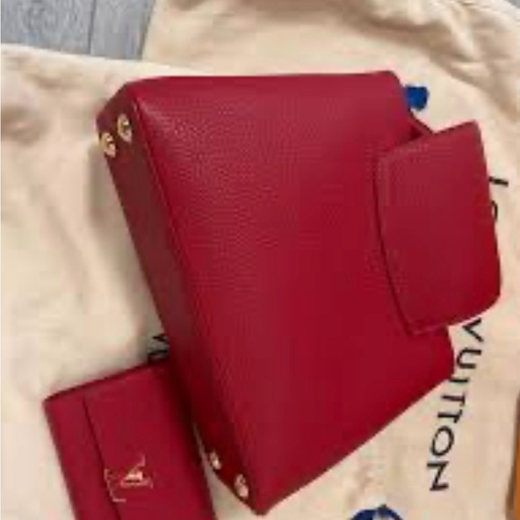 This is a Louis Vuitton Capucines Scarlet purse and matching wallet. - Picture 2 of 3